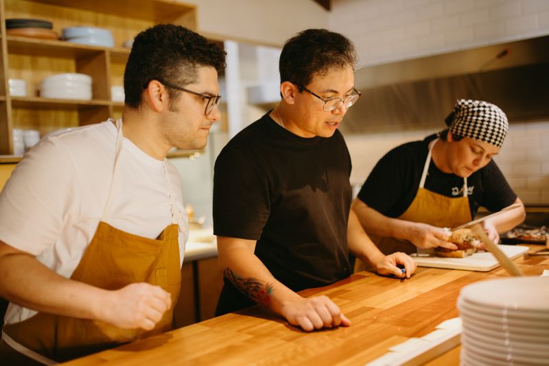 Starbird team preparing fresh chicken with care and quality